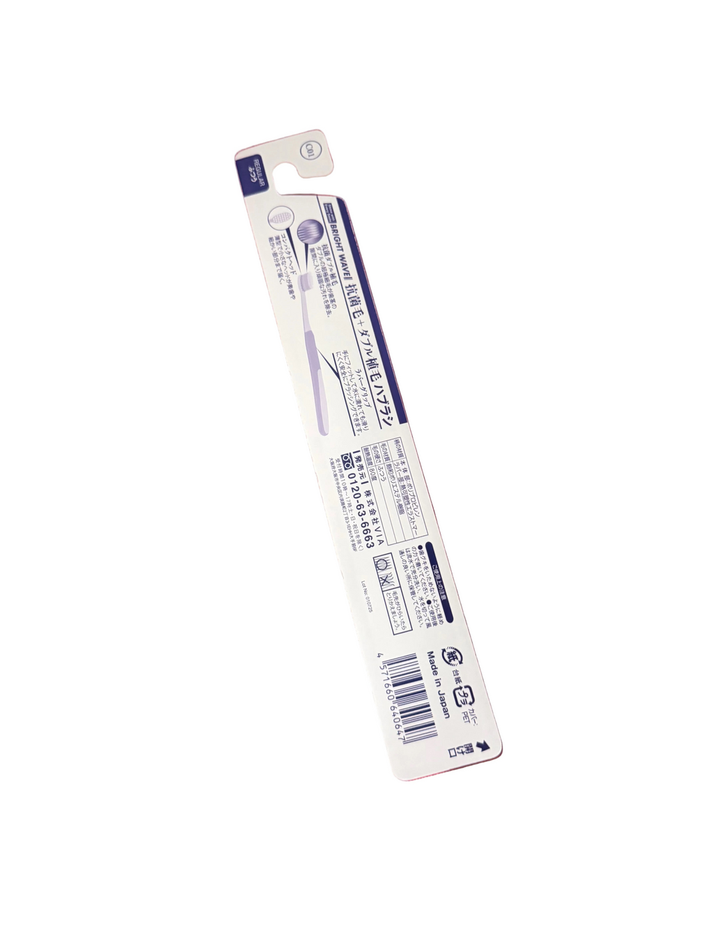 Back of toothbrush packaging on white surface